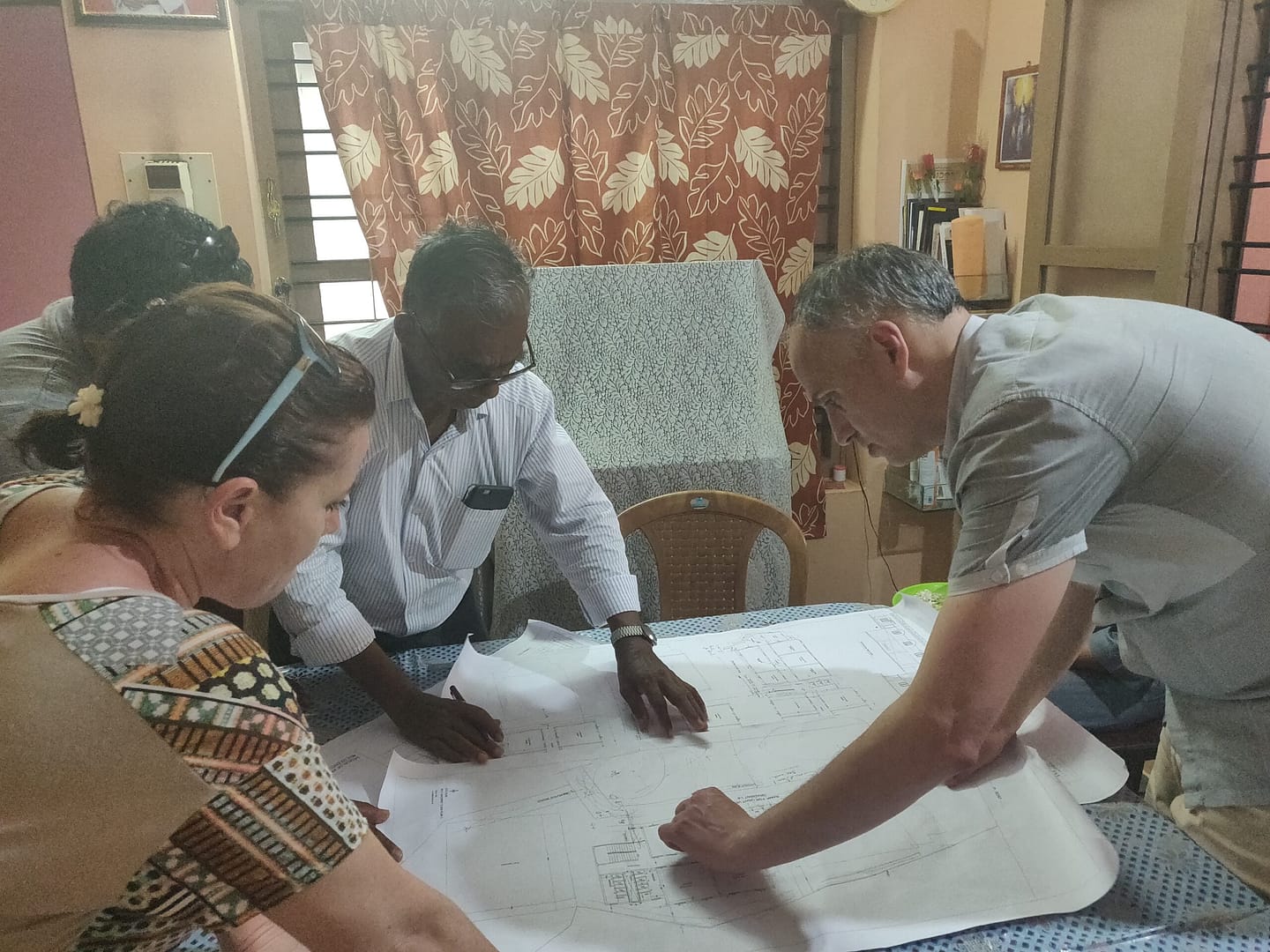 Maltese volunteers from the Malta Planning Authority assisting in planning and project planning.